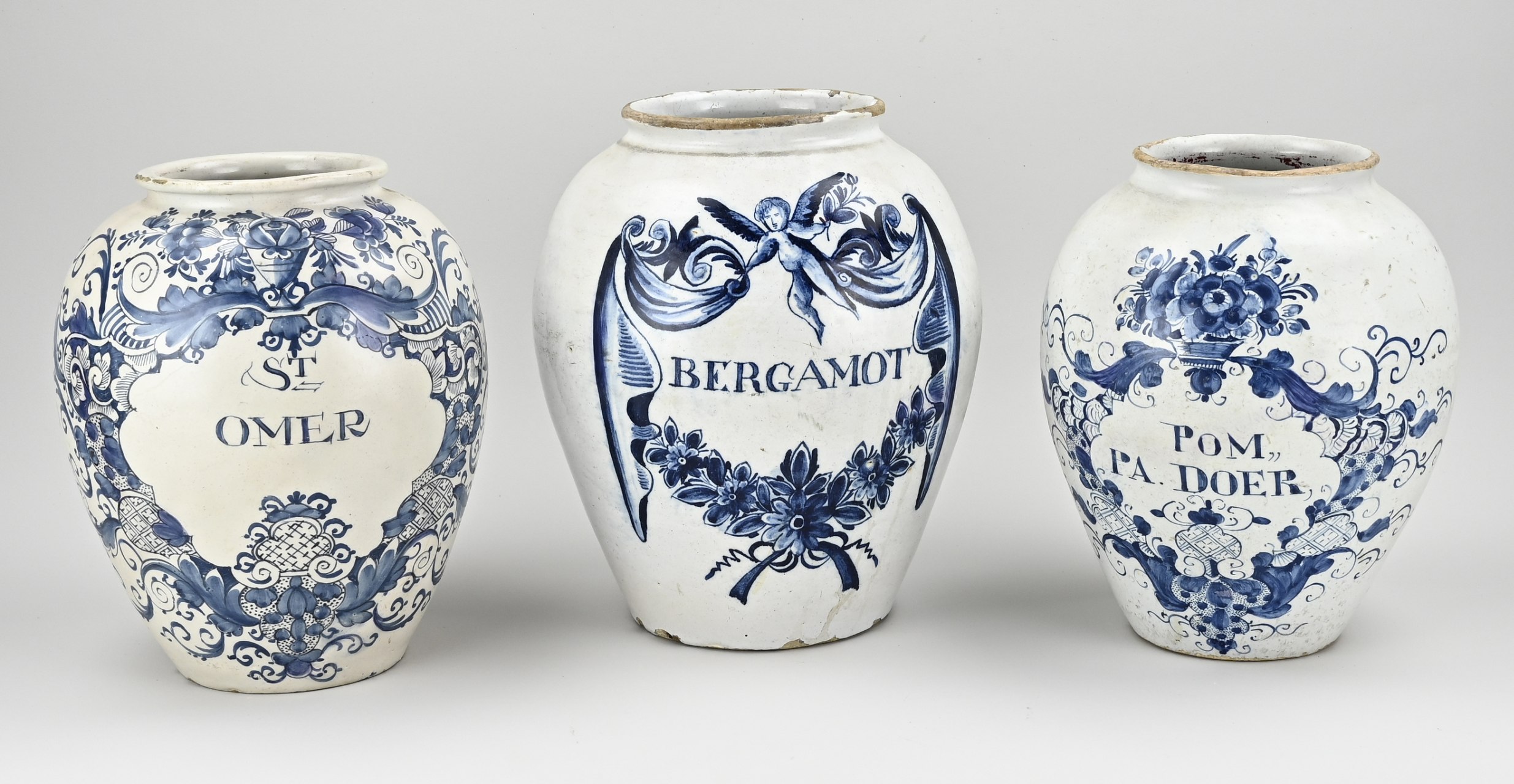 Three rare 18th century Delft fayence tobacco jars. 1x St. Omer, the three bells. 1x Pom. Dad. Doer (by Duyn). 1x Bergamot (three bells)